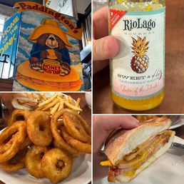 Hot sauce, Paddington's Famous Oink (Peameal-style bacon served on a fresh Kaiser with cheddar cheese), onion rings and fries
