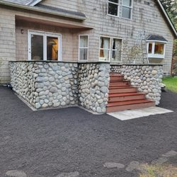 Heritage Landscaping Fence & Deck - Deck with round rock