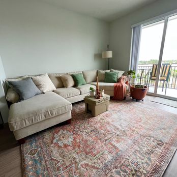 River North by Grand Peaks - Spacious family room with lots of natural light (my couch is 12ft 2" long and fits perfectly) - Apartments Near Me - Stuart, Florida