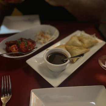 Ayesha Fine Dining - two plates of food and a glass of wine - Indian Near Me - Miami, Florida