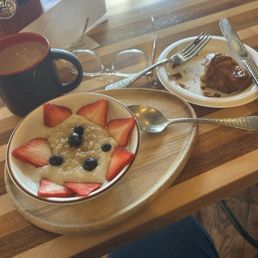 Coffee, steel cut oatmeal and a guava cream cheese croissant.