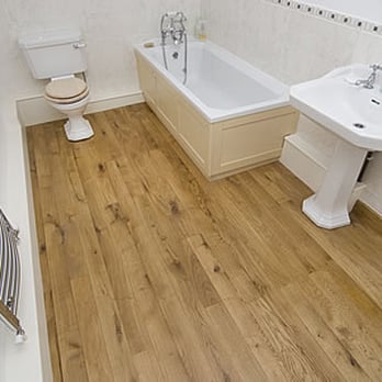 Donnie Flooring - a bathroom with a sink, toilet, and bathtub - Flooring Near Me Donnie Flooring - a bathroom with a sink, toilet, and bathtub - Flooring Near Me