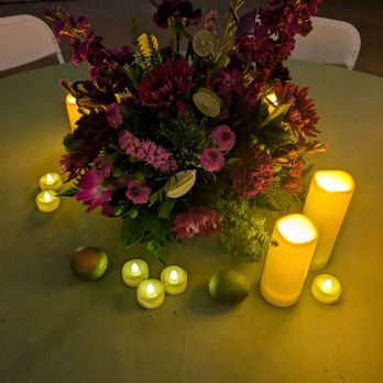 Crystal Gardens Florist - Purple and green floral centerpiece with limes and candles - Florists Near Me - Poway, California Crystal Gardens Florist - Purple and green floral centerpiece with limes and candles - Florists Near Me - Poway, California