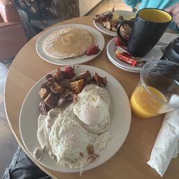Short Stack Pancakes, Biscuits and Country Gravy with over easy eggs, and freshly squeezed OJ