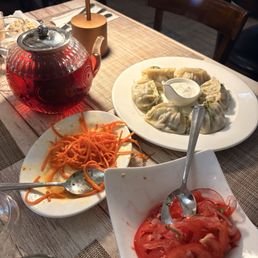 carrot and tomato salads, beef dumplings, hibiscus tea carrot and tomato salads, beef dumplings, hibiscus tea