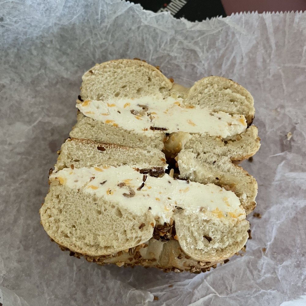 Montague Street Bagels - Garlic Bagel with Bacon Cheddar CC $5 - Bagels Near Me - Brooklyn, New York