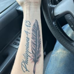 American Rebel Tattoo Studios - Eric did my feather and I'm really happy with it