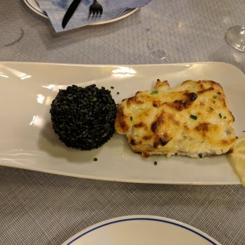 La Pescadería - Sea bass au gratin with black squid ink rice. Delicious! - Mediterranean Near Me - Tarifa, California