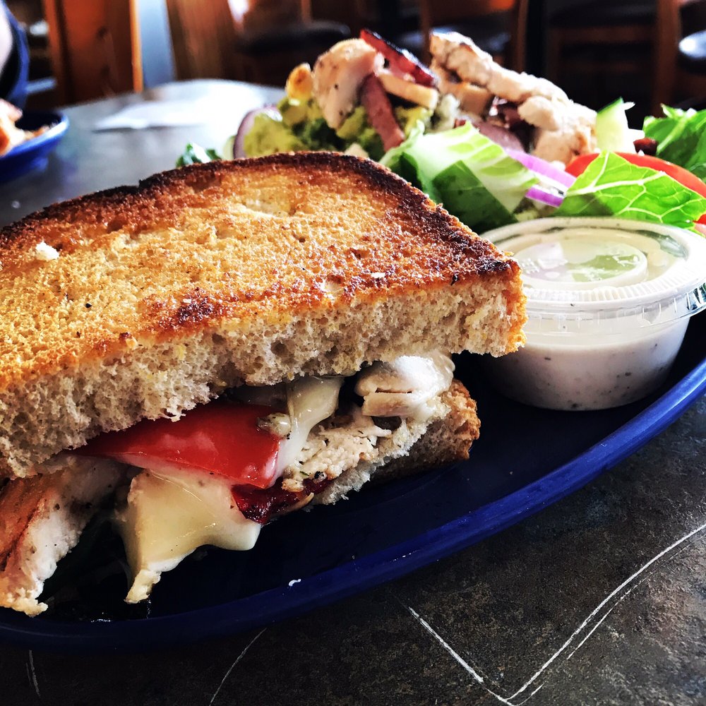a grilled cheese sandwich and salad