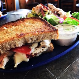 a grilled cheese sandwich and salad