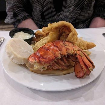 Savoy Restaurant - Ocean medley (fried lobster, catfish, and butterfly shrimp) on top of french fries - Seafood Near Me - Detroit, Michigan Savoy Restaurant - Ocean medley (fried lobster, catfish, and butterfly shrimp) on top of french fries - Seafood Near Me - Detroit, Michigan