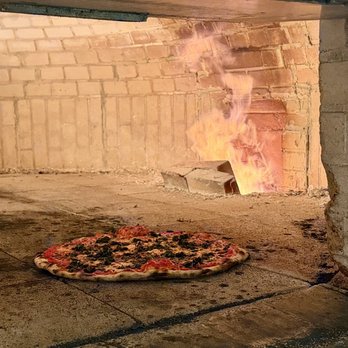 Olde World Apizza - Pizza cooking in the oven - Pizza Near Me - North Haven, Connecticut Olde World Apizza - Pizza cooking in the oven - Pizza Near Me - North Haven, Connecticut