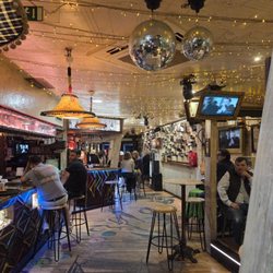 D'sastre - Cozy spot for drinks with friends. 80s-90s Spanish vibes, chill volume, and comfy nooks for small-group chats.