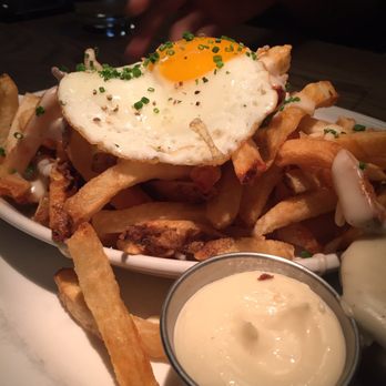 Au Cheval - Crispy Fries with Mornay Sauce, Garlic Aioli, and an egg!!! - Bars Near Me - Chicago, Illinois