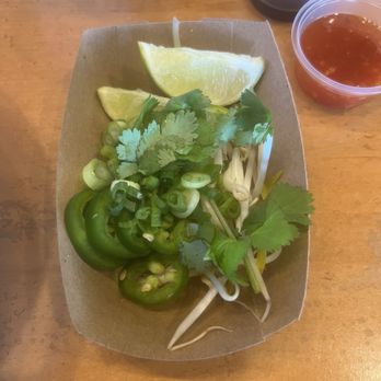 Viet-Nomz Waterford - Toppings: bean sprouts, cilantro, jalapeño, lime, green onions. - Vietnamese Near Me - Orlando, Florida Viet-Nomz Waterford - Toppings: bean sprouts, cilantro, jalapeño, lime, green onions. - Vietnamese Near Me - Orlando, Florida