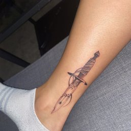 Dagger leg tattoo, super fresh only 8 hours old.