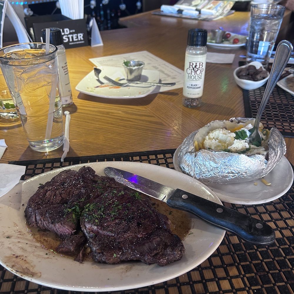 Rib & Chop House - It was a very good ribeye, seasoned excellent with a loaded potato plus a shot of tequila - Seafood Near Me - Cheyenne, Wyoming Rib & Chop House - It was a very good ribeye, seasoned excellent with a loaded potato plus a shot of tequila - Seafood Near Me - Cheyenne, Wyoming