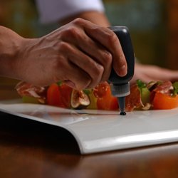 Summit Restaurant - Chef Luis putting the finishing touches on his plating.