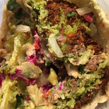 Oasis - Half eaten falafel sandwich - Middle Eastern Near Me - Brooklyn, New York
