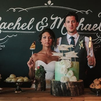 Trezzi Farm Winery - a bride and groom with their wedding cake - Wineries Near Me - Spokane, Washington