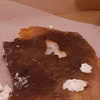 Angelina's Pizzeria - Bottom crust (I peeled away a couple pieces to show contrast on how much it was burnt. - Pizza Near Me - Queensbury, New York Angelina's Pizzeria - Bottom crust (I peeled away a couple pieces to show contrast on how much it was burnt. - Pizza Near Me - Queensbury, New York