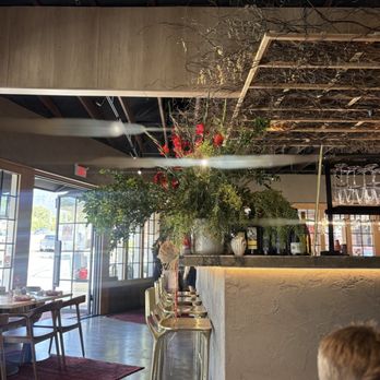 Monna - Fresh florals and look at the wooden chairs - Middle Eastern Near Me - La Crescenta-Montrose, California