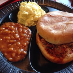 Pulled pork sandwich with BBQ beans and potato salad Pulled pork sandwich with BBQ beans and potato salad