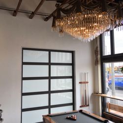 Empire Garage Door Service - Full view glass door dividing coffee shop from event space