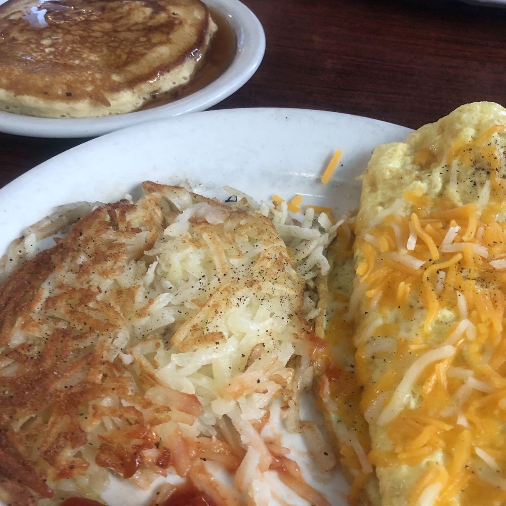 Small ham and cheese omelette with hashbrowns and pancake. Small ham and cheese omelette with hashbrowns and pancake.