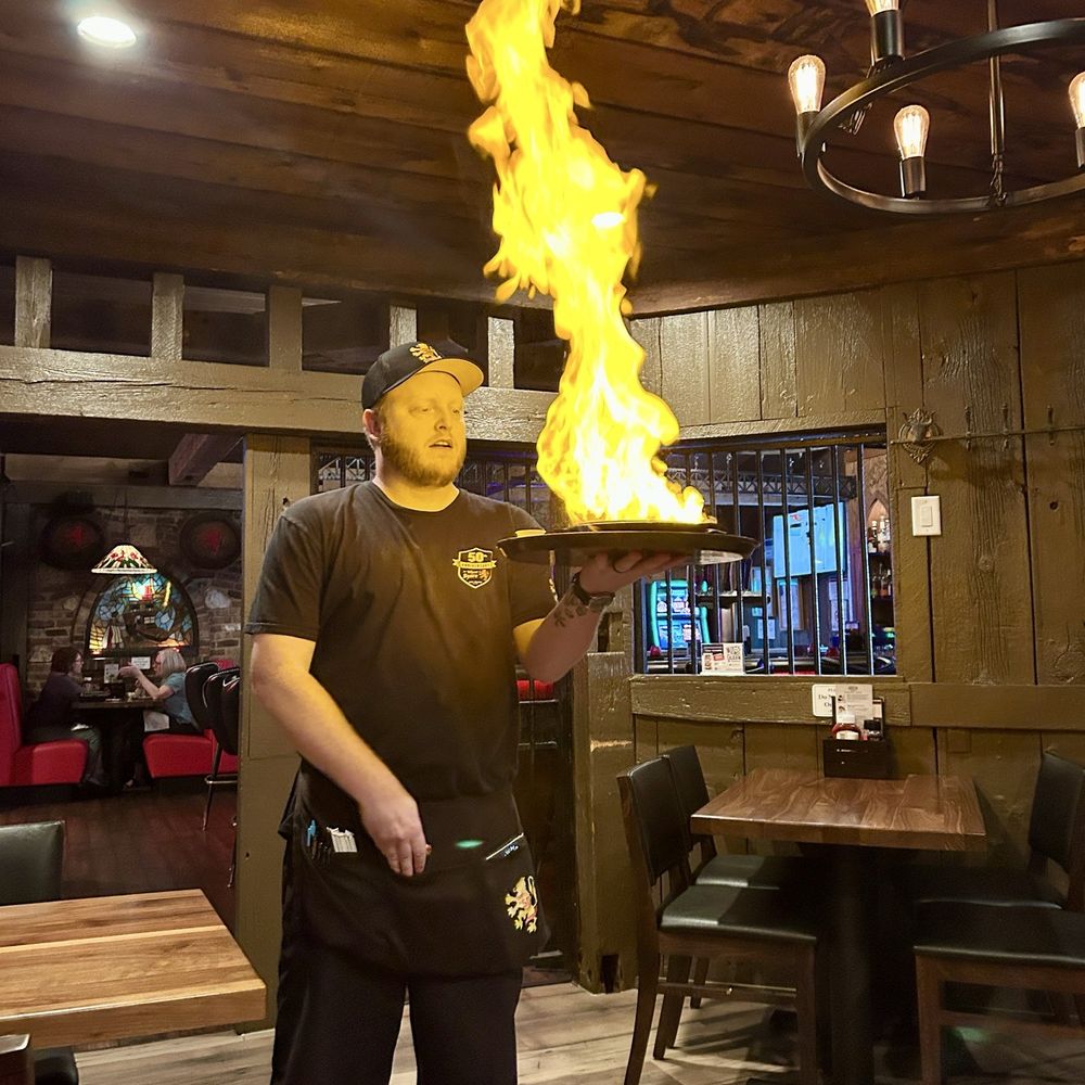 The Village Squire - Saganaki - Pizza Near Me - West Dundee, Illinois The Village Squire - Saganaki - Pizza Near Me - West Dundee, Illinois