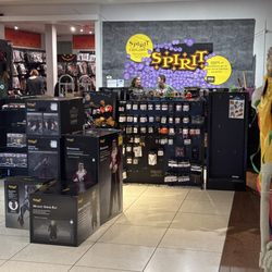 Spirit Halloween - Checkout Counter with 2 employees who are 'working' but unable to help a SOUL in the building.