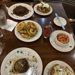 Two filet mignon's two baked potatoes, fully loaded, Dre, onion rings and order of their carrots Two filet mignon's two baked potatoes, fully loaded, Dre, onion rings and order of their carrots