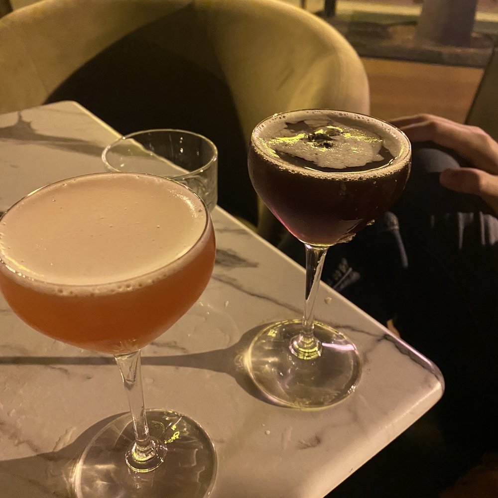 Rocks & Drams - Right to left: Queen Bee and Espresso Martini on Nitro - Cocktail Bars Near Me - Ventura, California Rocks & Drams - Right to left: Queen Bee and Espresso Martini on Nitro - Cocktail Bars Near Me - Ventura, California