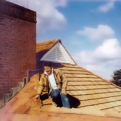 Island East Building - The owner, Paul Gabrielsen, working with the crews. Hand-split red cedar roofing.