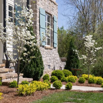 MC Homes - the front of a home with flowering trees - General Contractors Near Me - Paducah, Kentucky