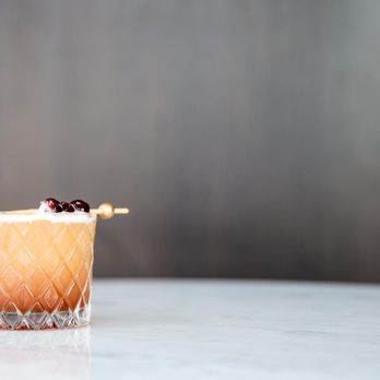 OneOneFour - a cocktail with a garnish of cherries - Restaurants Near Me - New York, New York OneOneFour - a cocktail with a garnish of cherries - Restaurants Near Me - New York, New York
