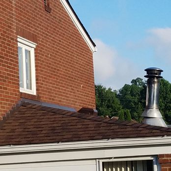 EAS Roofing - Crooked wood burner stack. Bad flashing with inch gap filled in with caulking.You can see brown edging instead of white as contract. - Roofing Near Me - Glenshaw, Pennsylvania EAS Roofing - Crooked wood burner stack. Bad flashing with inch gap filled in with caulking.You can see brown edging instead of white as contract. - Roofing Near Me - Glenshaw, Pennsylvania