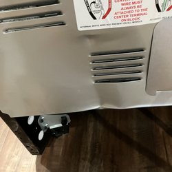 Dented back of electric Frigidaire Range. Did not know it had been damaged until it was replaced with gas range.