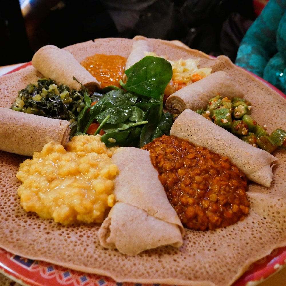 Selam Vegan - a plate of food on a table - Ethiopian Near Me - Toronto, Ontario Selam Vegan - a plate of food on a table - Ethiopian Near Me - Toronto, Ontario