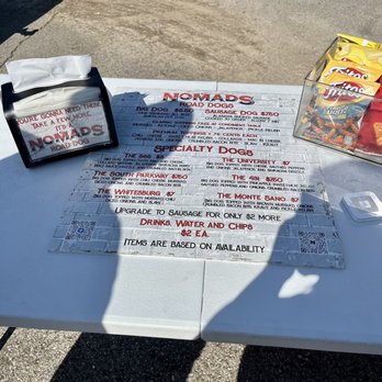 Nomads Road Dogs - Menu (2/14/23), napkins, chips - Food Trucks Near Me Nomads Road Dogs - Menu (2/14/23), napkins, chips - Food Trucks Near Me
