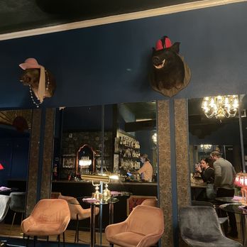 Little Zooks - a bar with a lot of stuffed animals on the wall - Cocktail Bars Near Me - Brunswick, Georgia