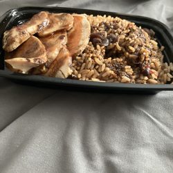 Fish Fry Fridays - Small portions of white meat jerk chicken with rice and pea. That contain should be bigger then this for the money I spend for it