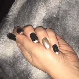 Black with gold French tips Black with gold French tips