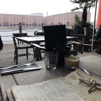 The Smugglers Cove - View from the table, large glass windows - Bars Near Me - Liverpool, XMS The Smugglers Cove - View from the table, large glass windows - Bars Near Me - Liverpool, XMS