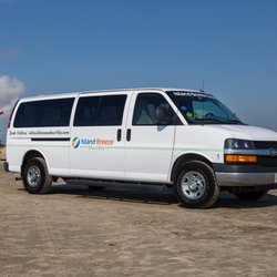 Island Breeze Shuttle - Island Breeze Shuttle Van on the beach in Galveston