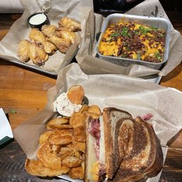 Reuben with house chips in bottom. Wings top left and Loaded Shepards Pie top right! Reuben with house chips in bottom. Wings top left and Loaded Shepards Pie top right!