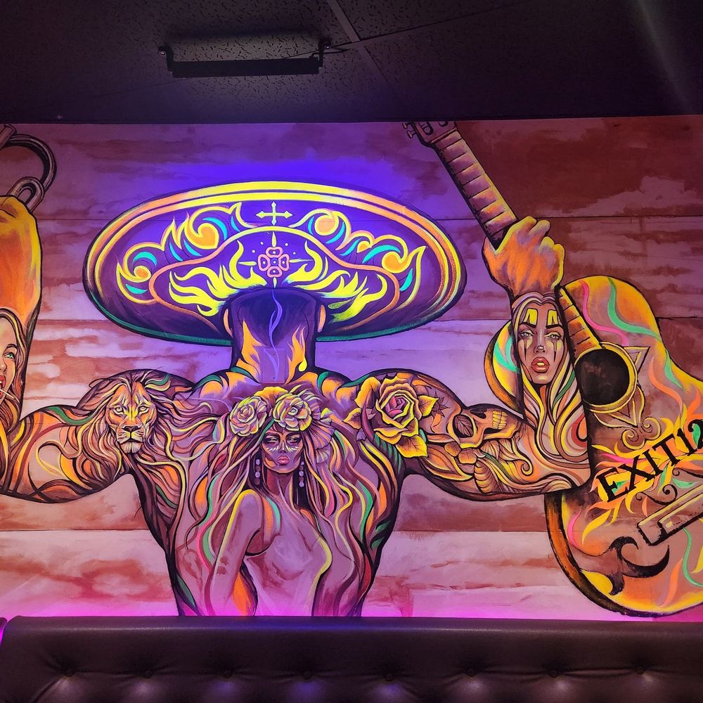 Exit 12 Bar - a mural of a man with a sombren and a guitar - Mexican Near Me - Carteret, New Jersey