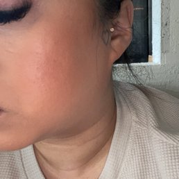 Tragus piercing with a pretty, iridescent gem. Tragus piercing with a pretty, iridescent gem.