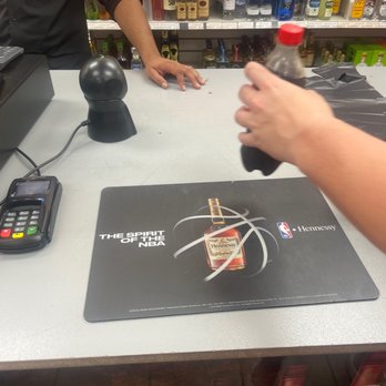 Liquor Mart - a person pouring a bottle of liquor - Beer, Wine & Spirits Near Me - Little Elm, Texas Liquor Mart - a person pouring a bottle of liquor - Beer, Wine & Spirits Near Me - Little Elm, Texas