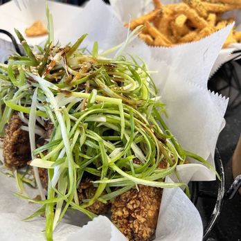 92 Chicken - Soy Garlic Spring Onion with cheesy fries in the back - Chicken Wings Near Me - Orlando, Florida
